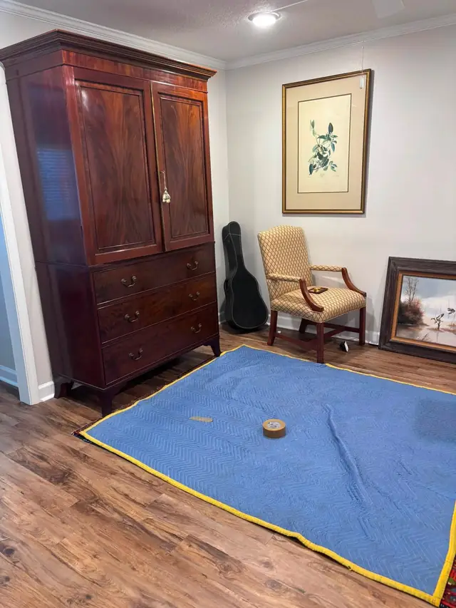 Wooden armoire in a bedroom, ready to be wrapped