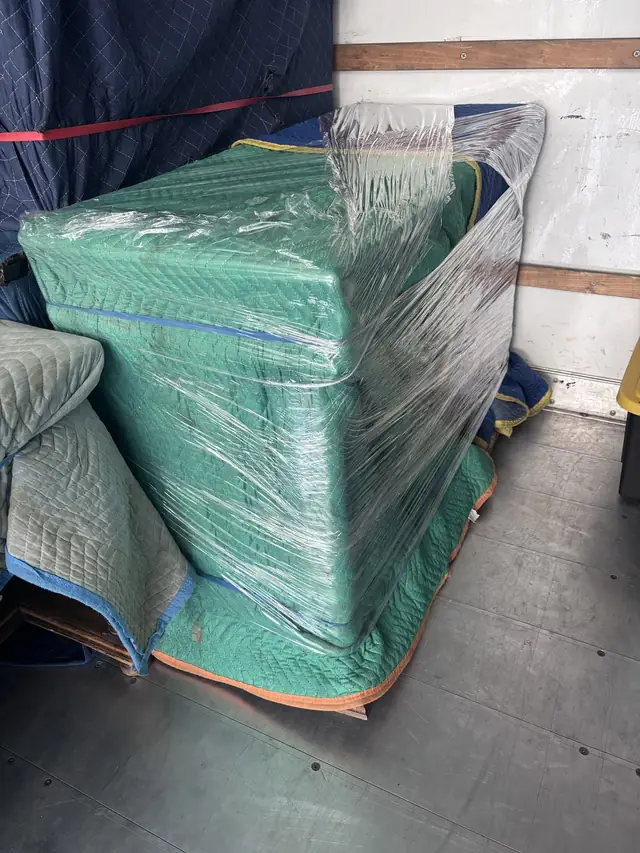 Padded and shrink-wrapped chair in the truck