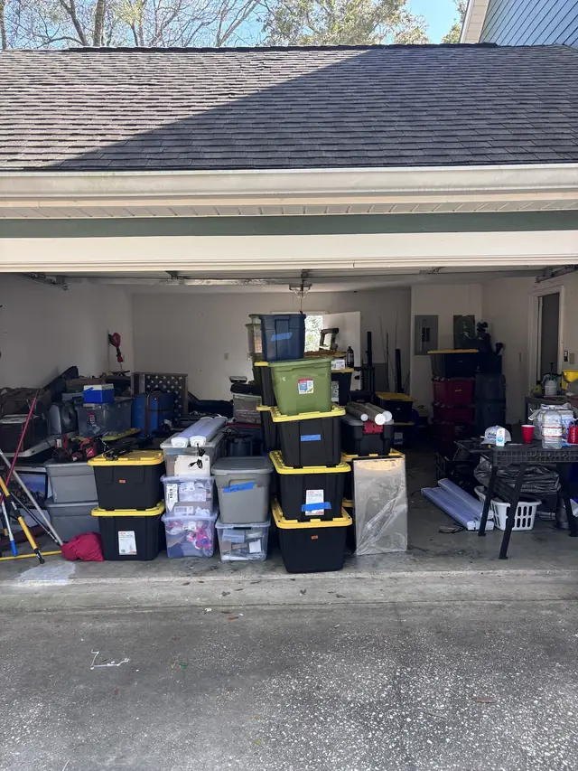 Garage with storage totes organized and ready to load