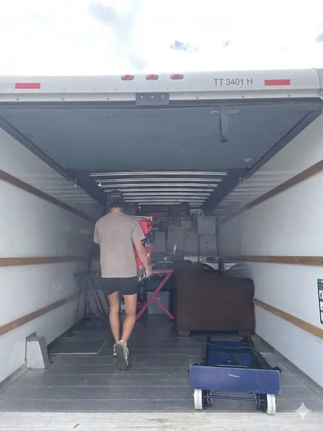 Mover loading furniture inside the truck
