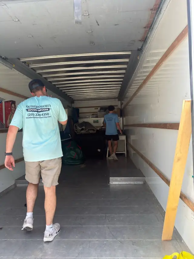 Mover walking into the truck to load