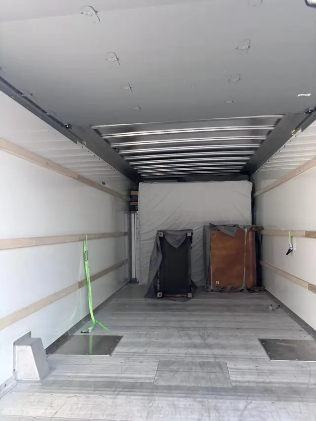 Truck interior with items strapped and secured