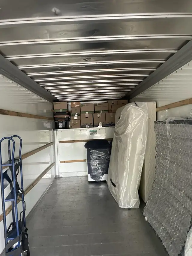Wrapped mattress secured inside the truck