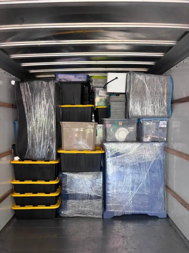 Truck packed floor to ceiling with wrapped furniture