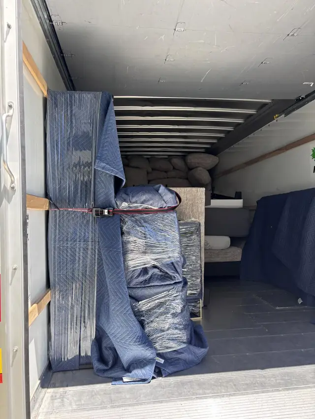 Moving pads strapped along the truck wall