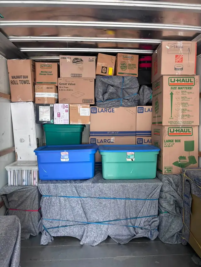Truck loaded with a tight wall of boxes and totes